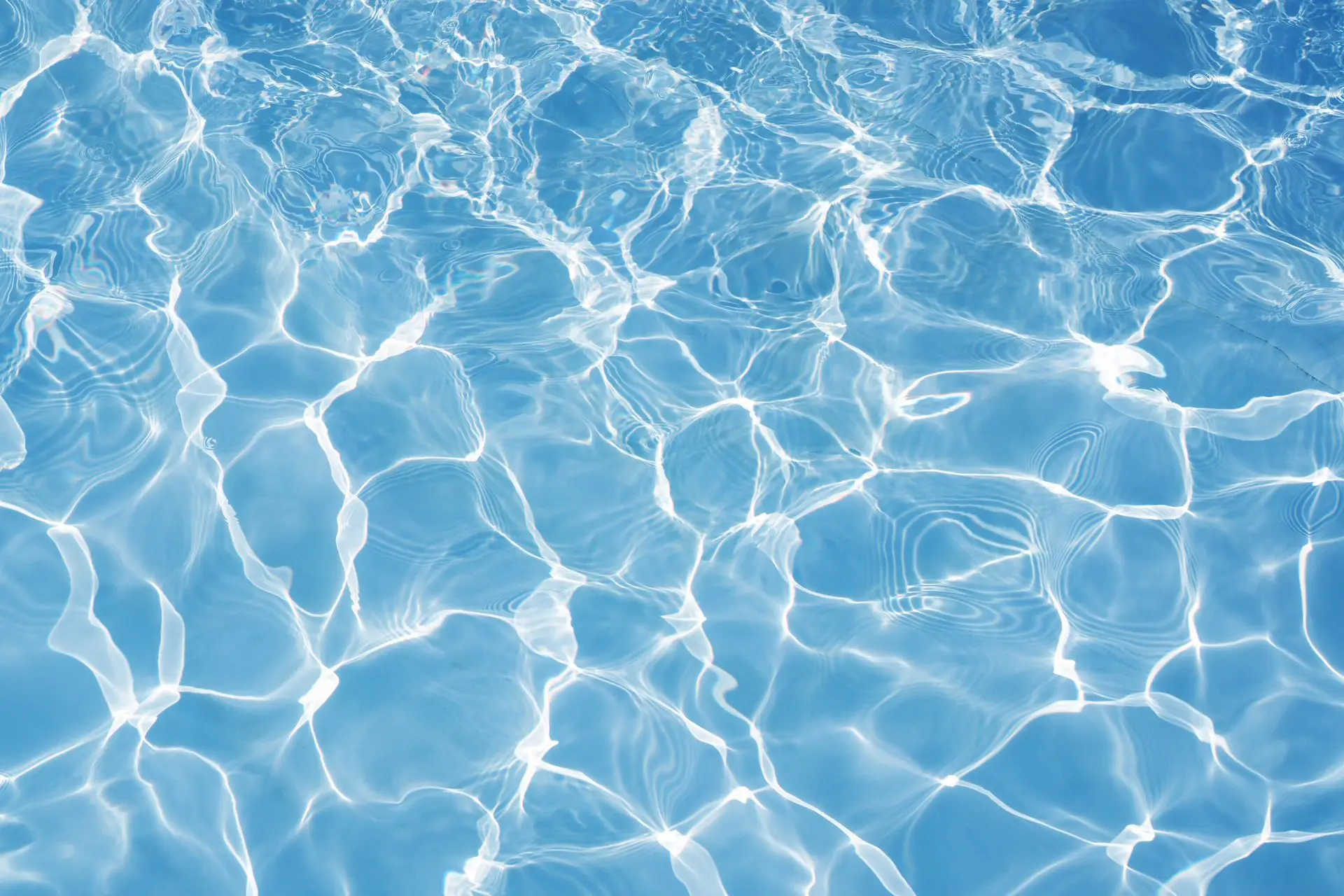 Sunlight rippling through clear water
